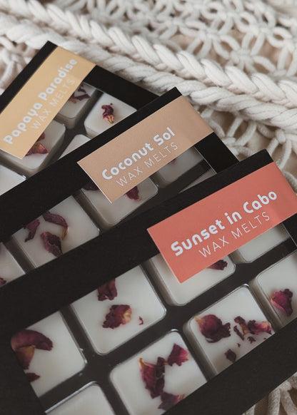 Wax melts packaging with visible labels on a textured surface