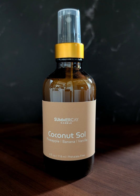 Bottle of 'Coconut Sol' on a wooden surface with a dark background