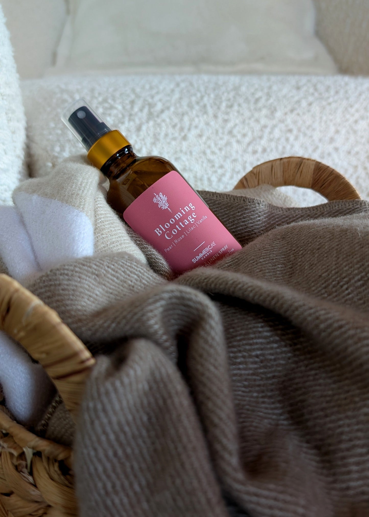 Small brown bottle with a pink label on a textured surface