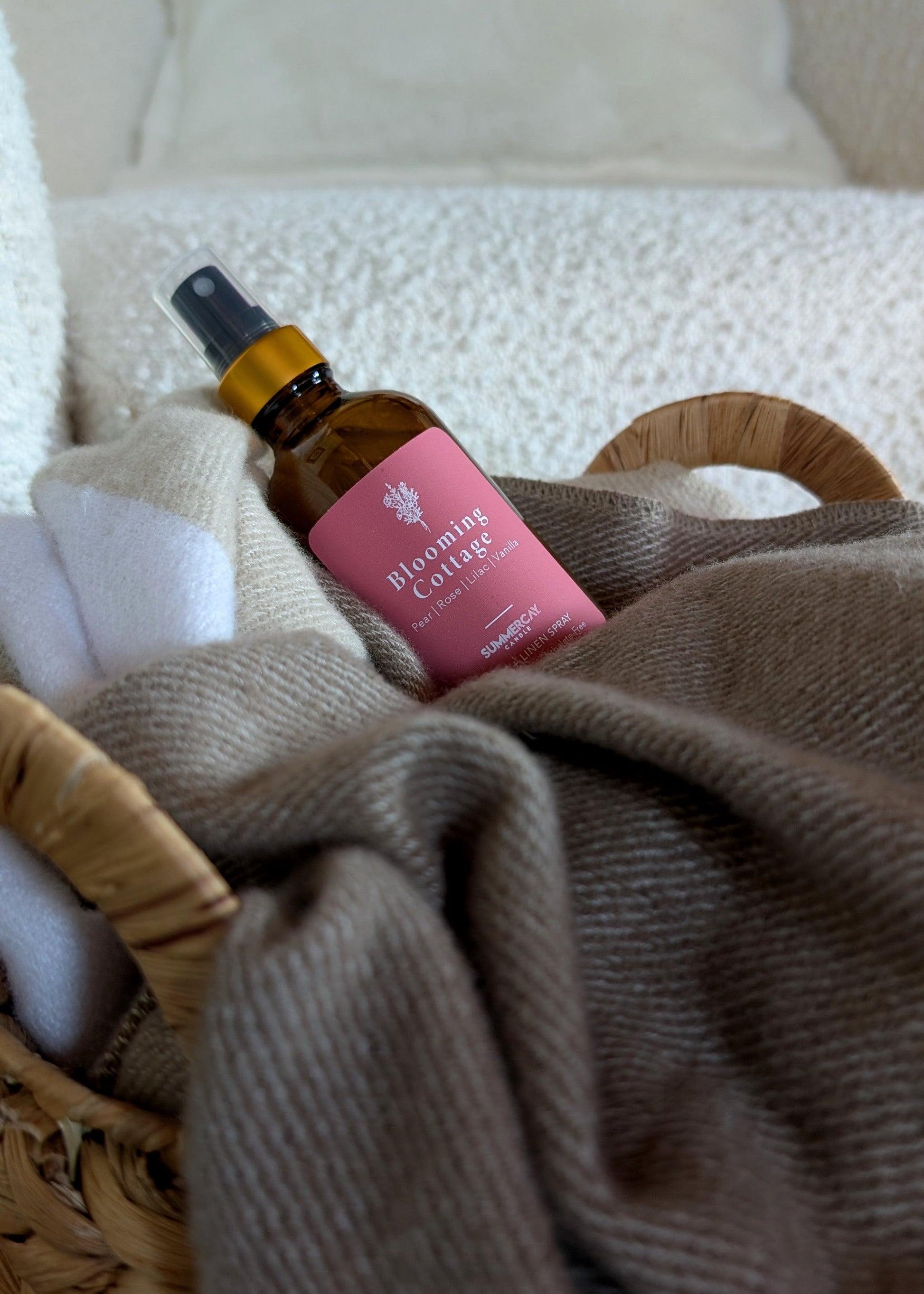 Small brown bottle with a pink label on a textured surface