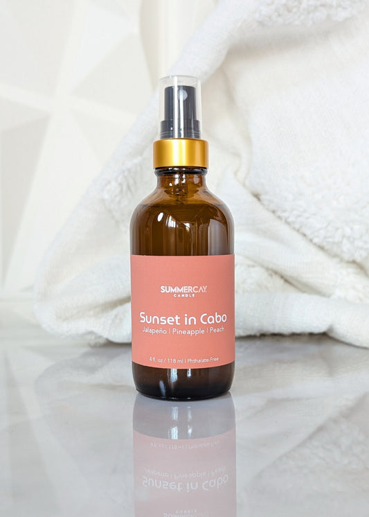 amber glass spray bottle with Sunset in Cabo label on a white background
